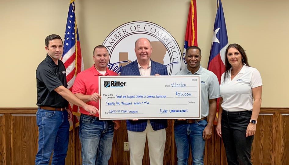 Ritter Communications employees presenting the $25,000 check to the Texarkana Small Business Support Program.